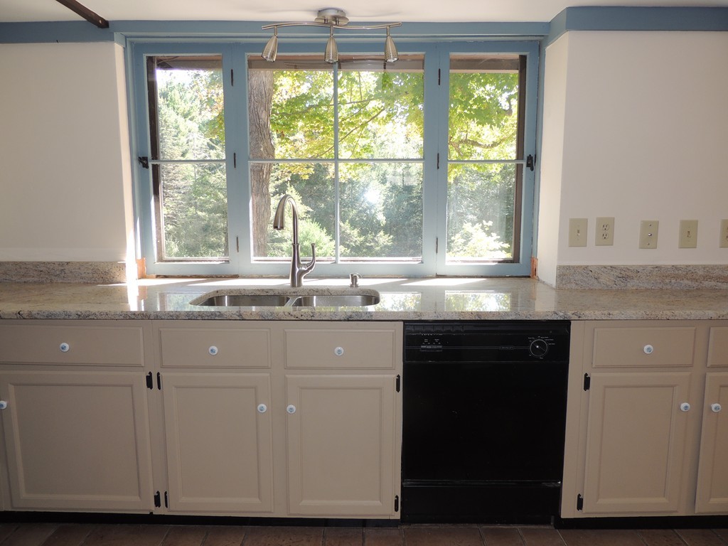 400 Lower Hampden Road Monson, MA 01057 - Photo 10 of 30 a kitchen with granite countertop a window and a sink