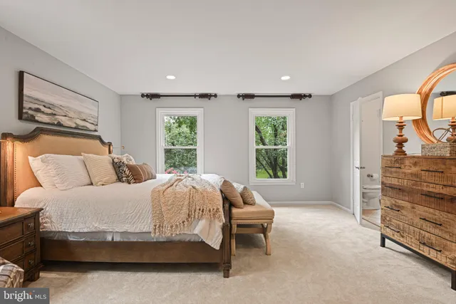 a bathroom with a granite countertop shower a mirror and a shower