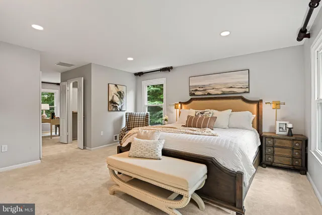 a bathroom with a toilet a sink and a mirror