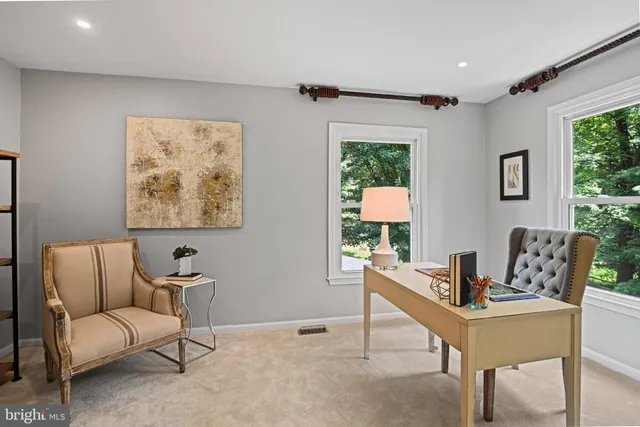 a view of hallway with wooden floor