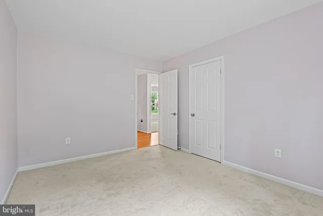 an empty room with a empty space and a ceiling fan