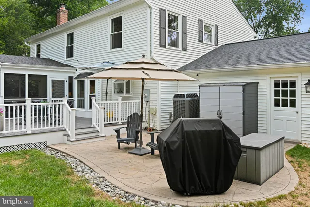 a view of a chairs and table in backyard
