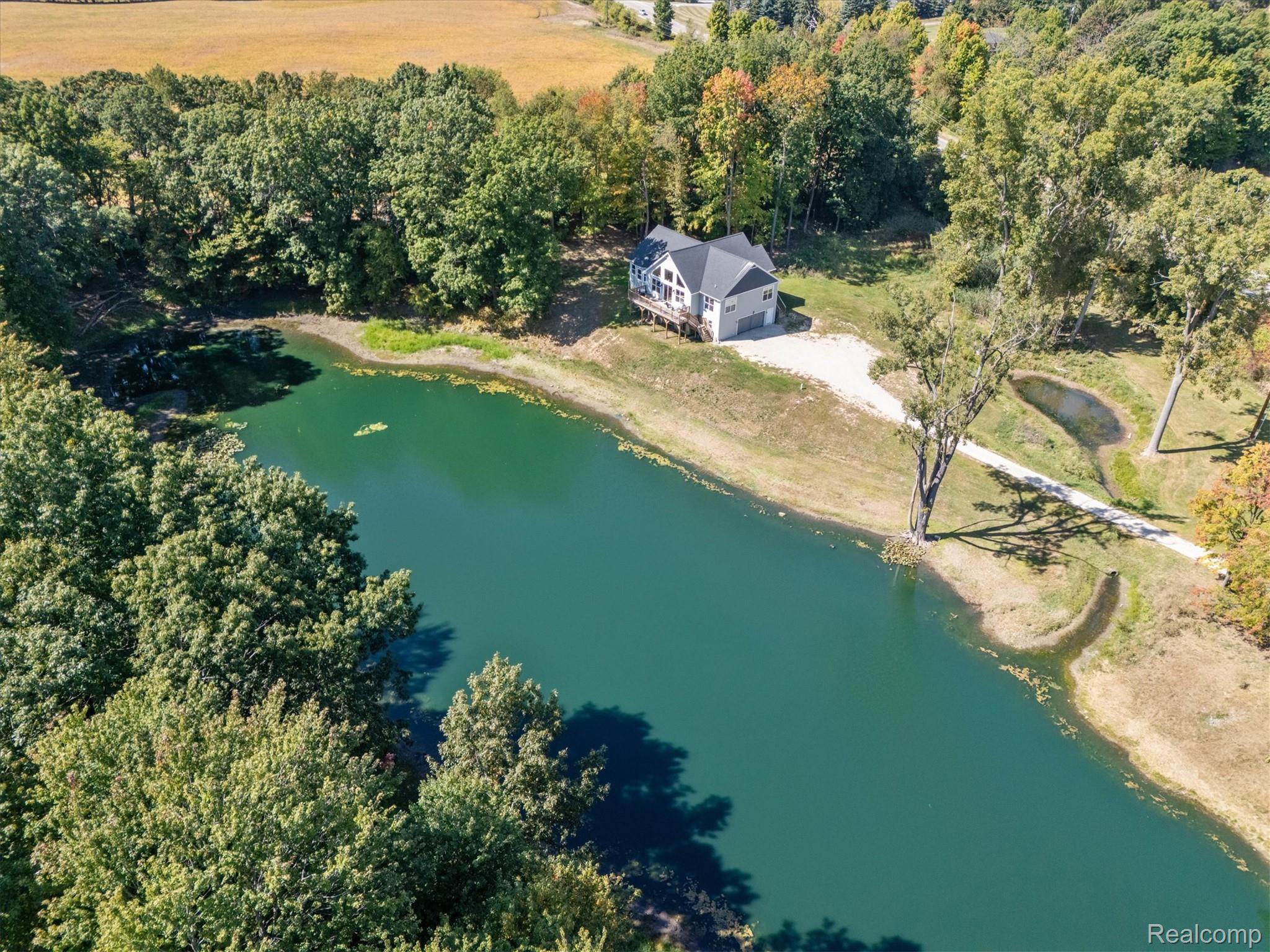 441 West Dryden Road Metamora, MI 48455 - Photo 11 of 62 Aerial view of property's location featuring a large body of water and a forest