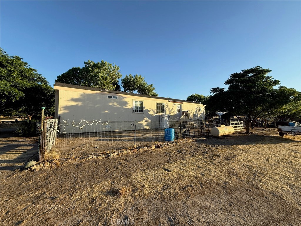 6535 O'Donovan Road Creston, CA 93432 - Photo 10 of 18 a view of a yard with wooden fence