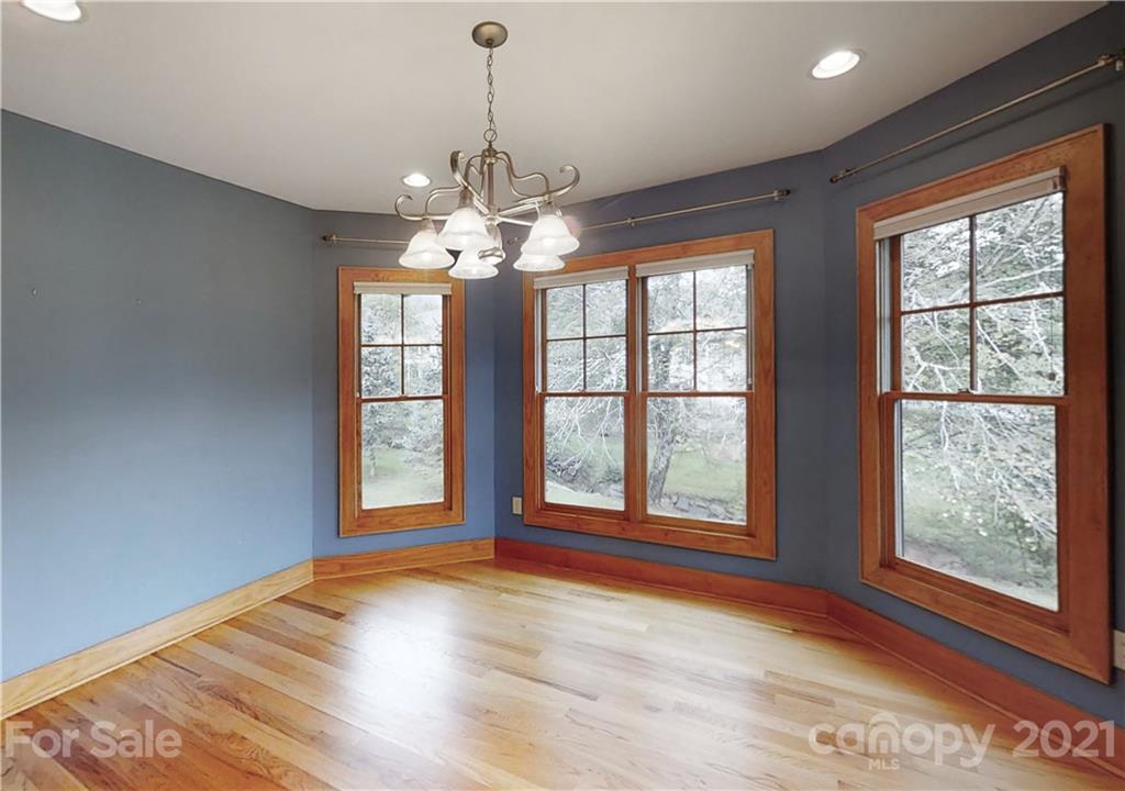 56 Devonshire Drive Mills River, NC 28759 - Photo 12 of 43 a view of an empty room with wooden floor and a window