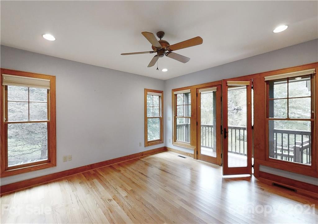 56 Devonshire Drive Mills River, NC 28759 - Photo 13 of 43 a view of an empty room with a window and wooden floor