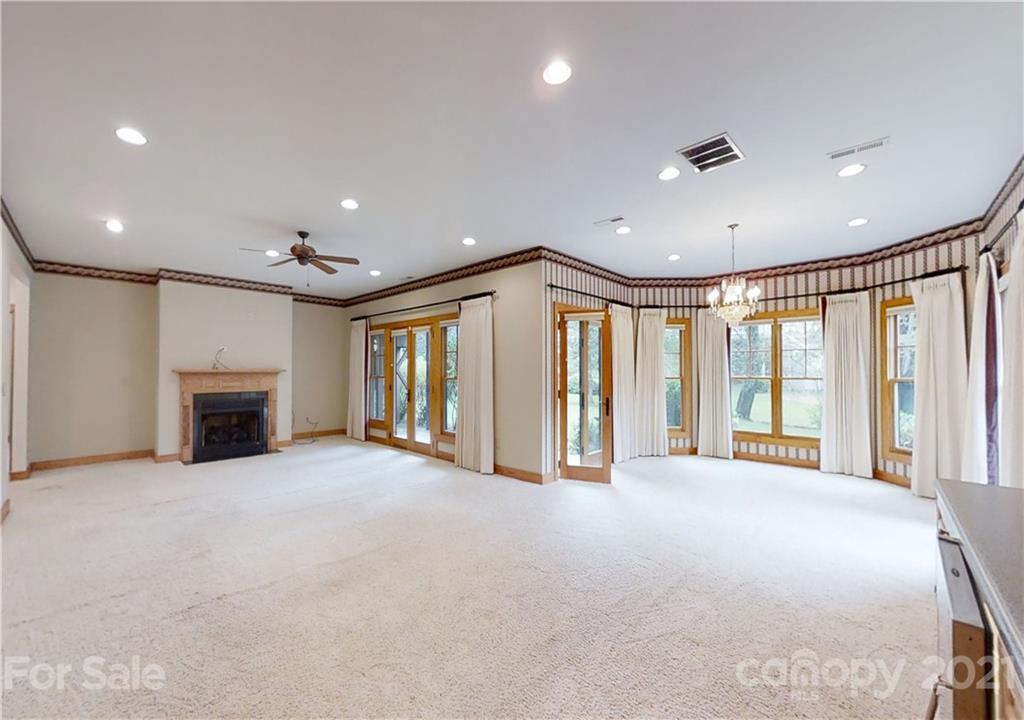 56 Devonshire Drive Mills River, NC 28759 - Photo 22 of 43 a view of an empty room with a fireplace and a large window