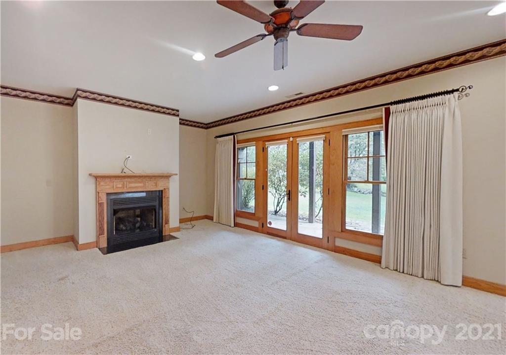 56 Devonshire Drive Mills River, NC 28759 - Photo 23 of 43 a view of an empty room with a fireplace and a window