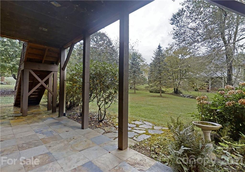 56 Devonshire Drive Mills River, NC 28759 - Photo 27 of 43 a view of a wooden door and floor to ceiling window