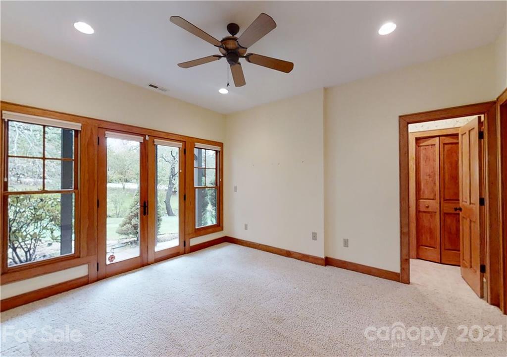 56 Devonshire Drive Mills River, NC 28759 - Photo 32 of 43 an empty room with chandelier fan and windows