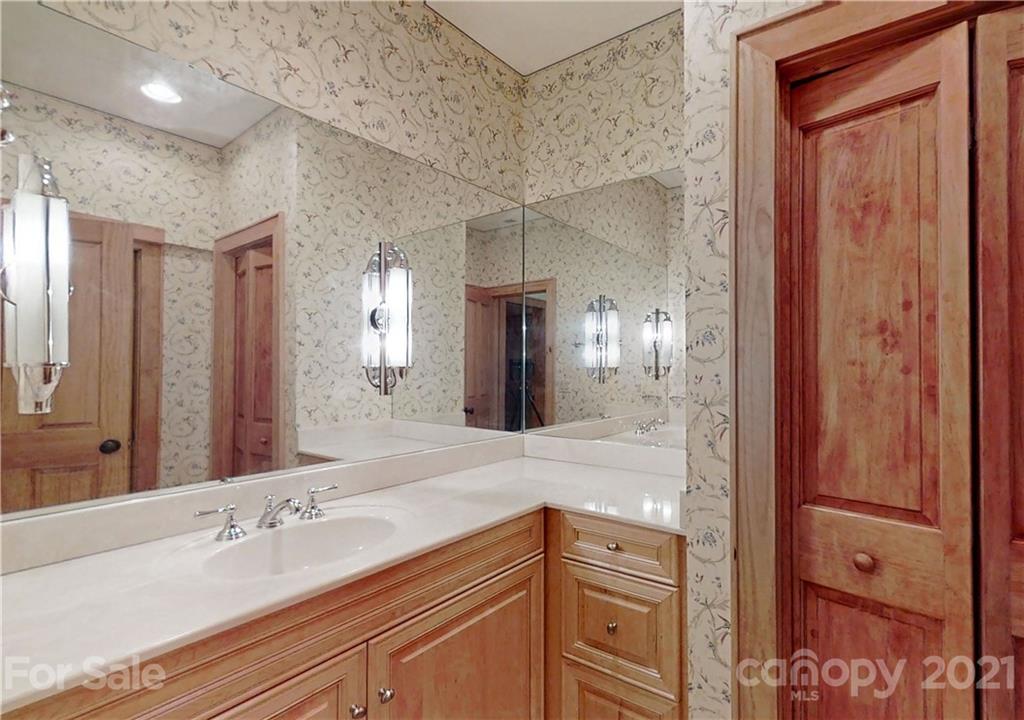56 Devonshire Drive Mills River, NC 28759 - Photo 34 of 43 a spacious bathroom with a double vanity sink and a mirror