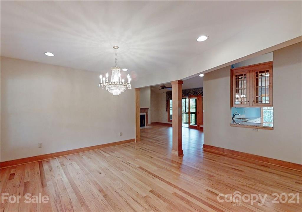 56 Devonshire Drive Mills River, NC 28759 - Photo 6 of 43 a view of an empty room with wooden floor and a window