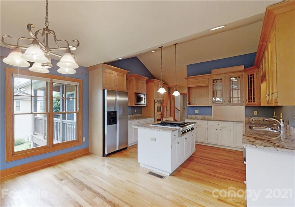 56 Devonshire Drive Mills River, NC 28759 - Photo 10 of 43 a kitchen with stainless steel appliances granite countertop a sink a stove and a refrigerator