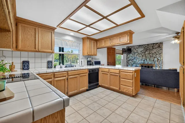 a bathroom with a toilet a sink and a window