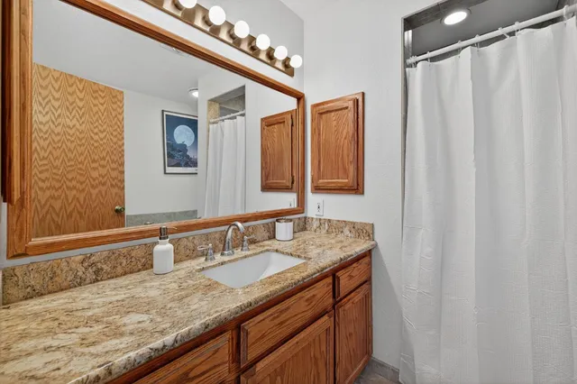 a view of a house with a swimming pool and sitting area