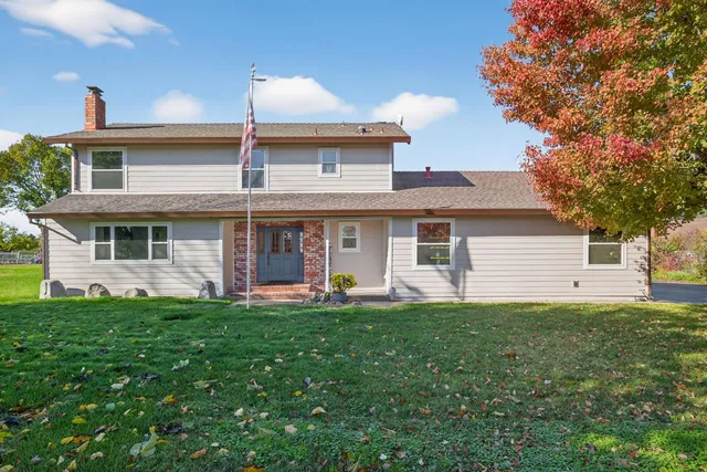 a view of staircase with white walls and a window