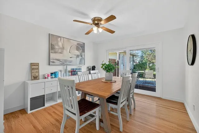 a kitchen with stainless steel appliances kitchen island granite countertop a refrigerator and a sink