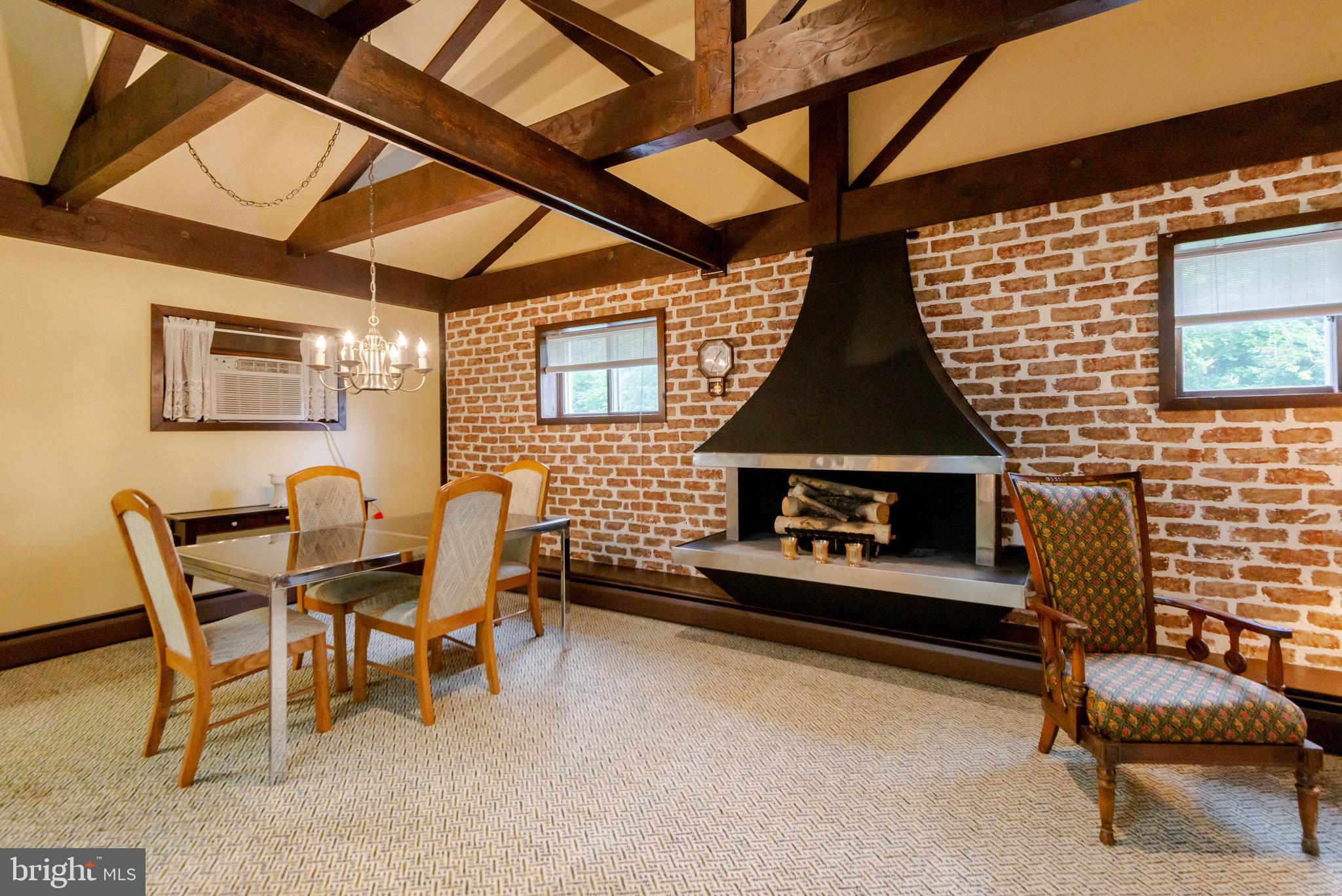 2354 Sandymount Road Finksburg, MD 21048 - Photo 6 of 49 FP and cathedral ceiling with exposed brick wall