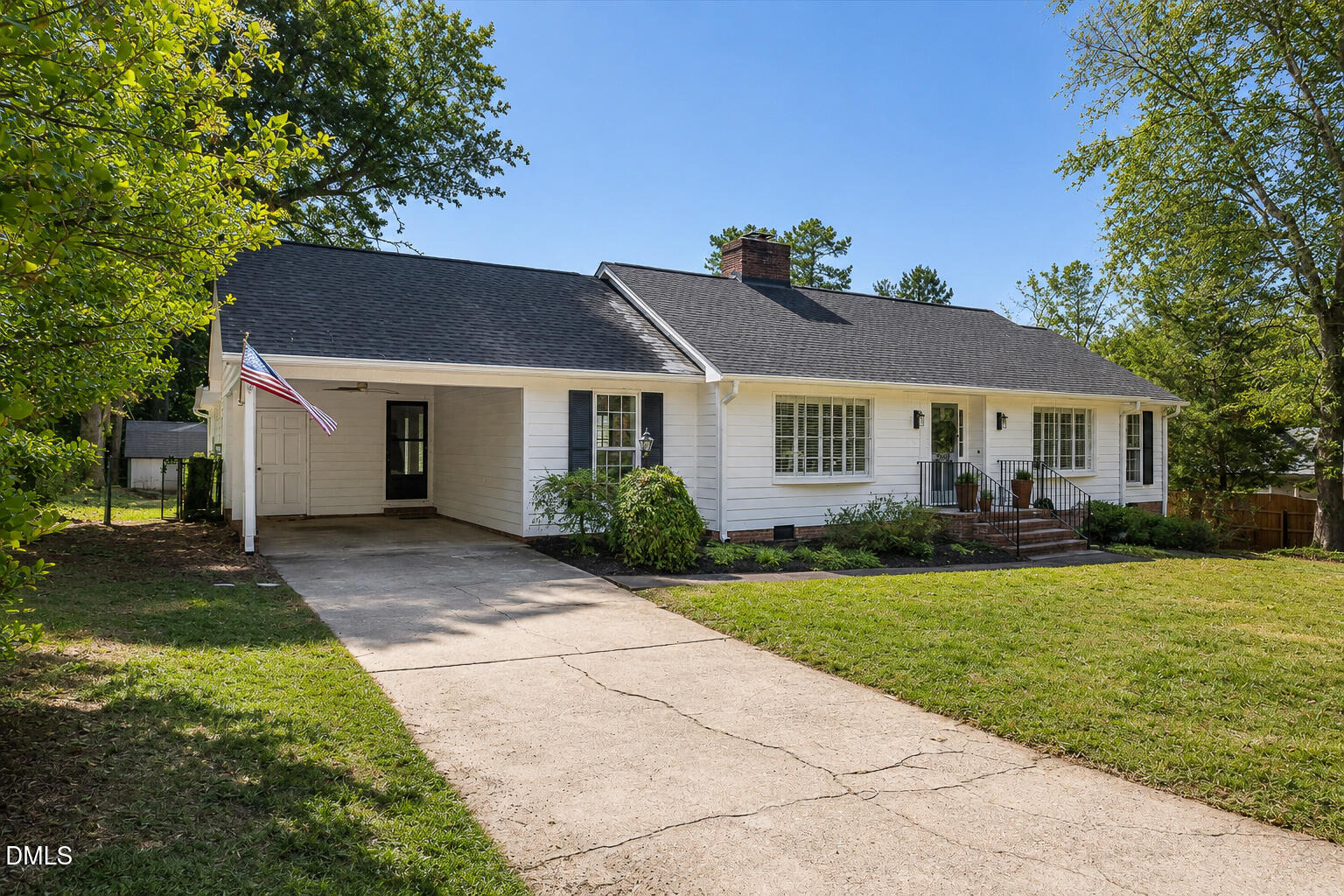 5904 Volant Drive Raleigh, NC 27609 - Photo 4 of 42 a front view of a house with a garden
