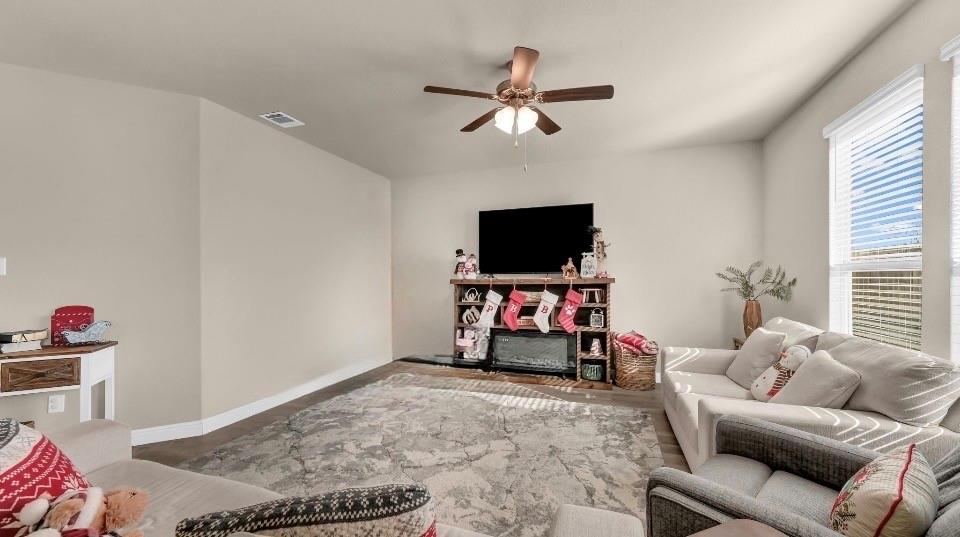 2429 Goodnight Ranch Drive Weatherford, TX 76087 - Photo 12 of 32 a living room with furniture and a flat screen tv