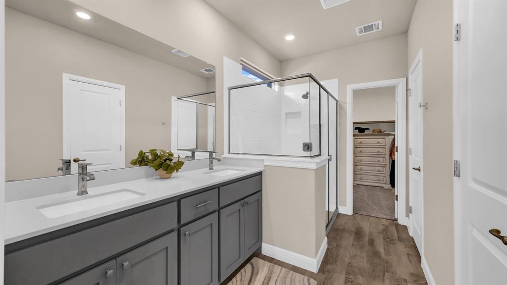 2429 Goodnight Ranch Drive Weatherford, TX 76087 - Photo 18 of 32 a bathroom with a double vanity sink mirror and double