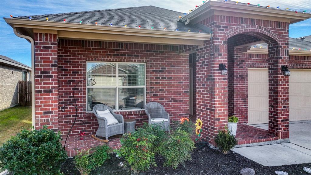 2429 Goodnight Ranch Drive Weatherford, TX 76087 - Photo 2 of 32 a front view of a house with plants