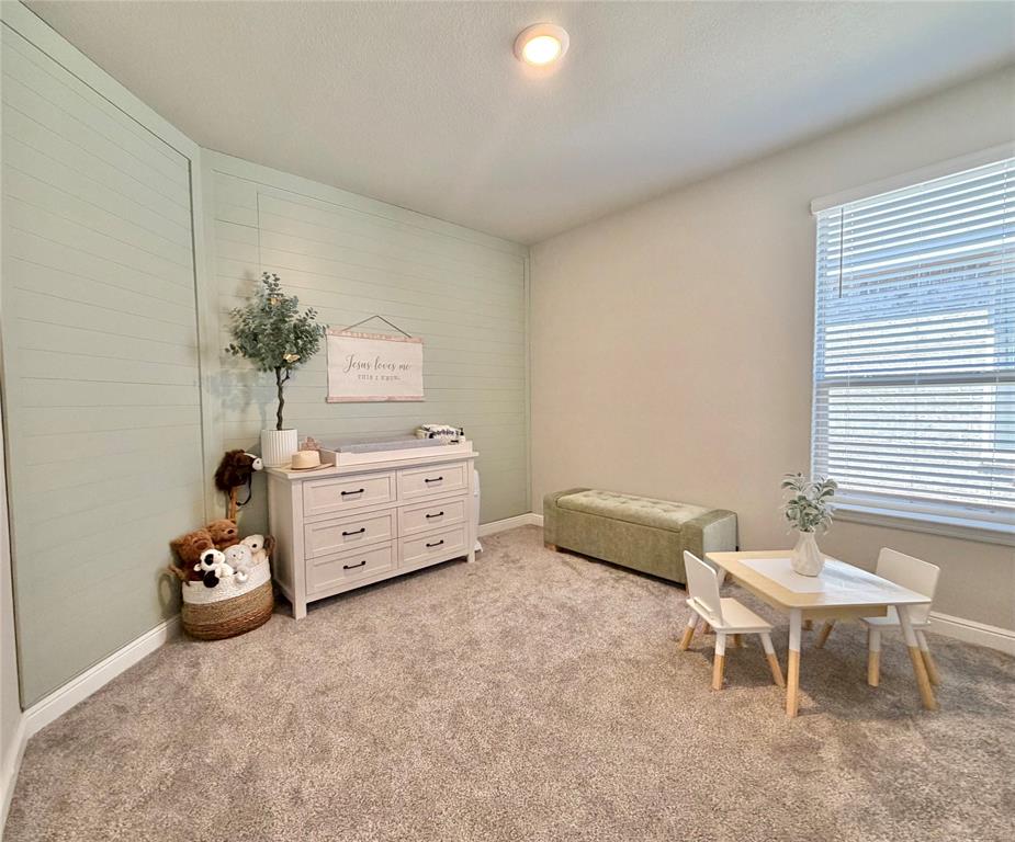 2429 Goodnight Ranch Drive Weatherford, TX 76087 - Photo 22 of 32 a bedroom with a bed and a couch