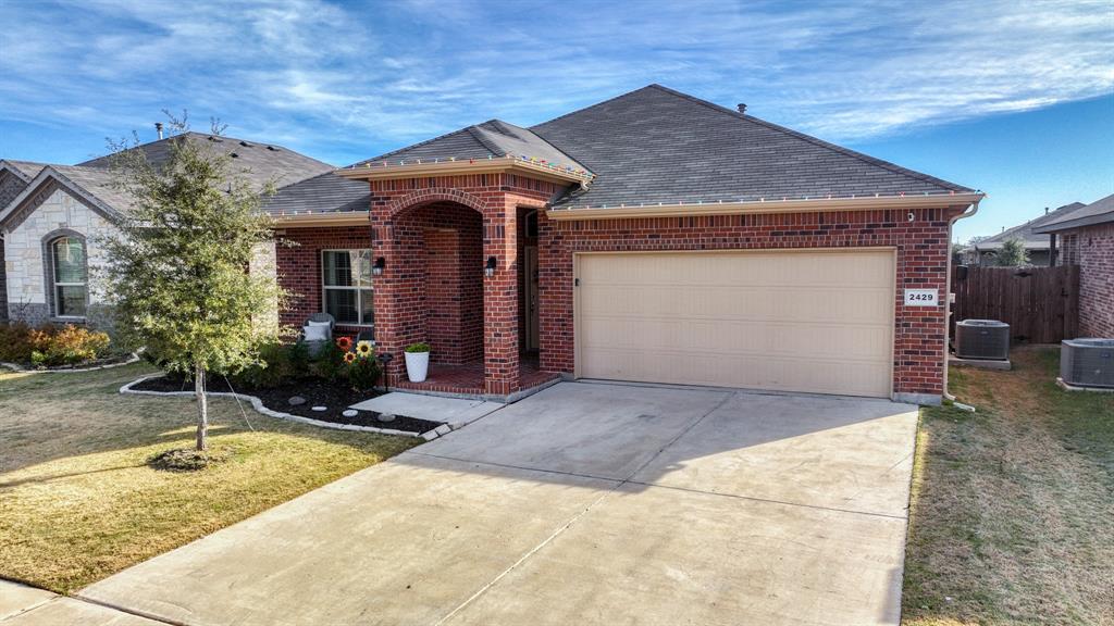 2429 Goodnight Ranch Drive Weatherford, TX 76087 - Photo 27 of 32 a front view of a house with garden