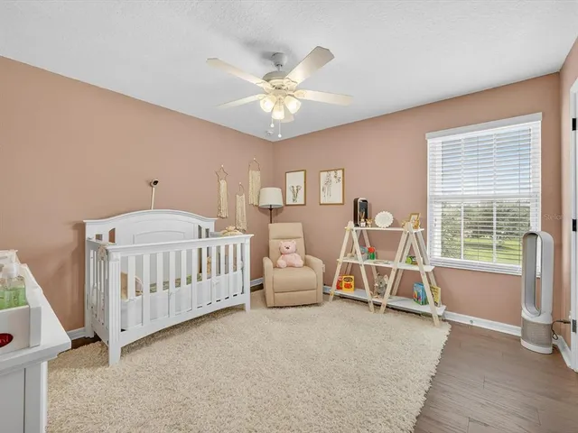 a bedroom with furniture and windows