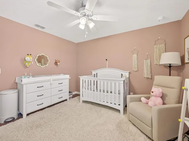 a bedroom with furniture and a chandelier