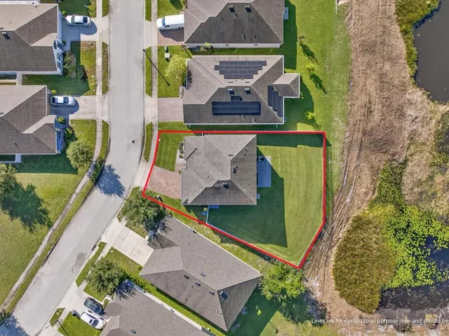 an aerial view of a house with a garden