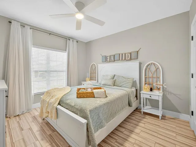 a bedroom with a bed and a flat screen television