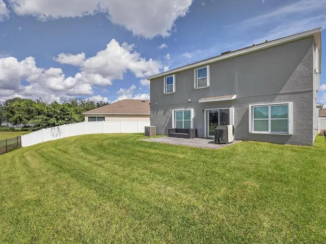 a view of a lake with houses in the background