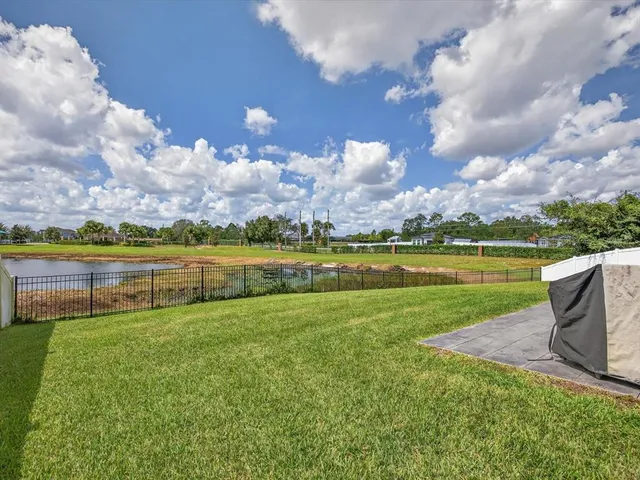 a view of a lake with a big yard