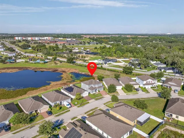 an aerial view of residential houses and outdoor space