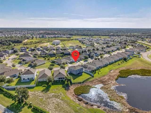 an aerial view of a house with a garden