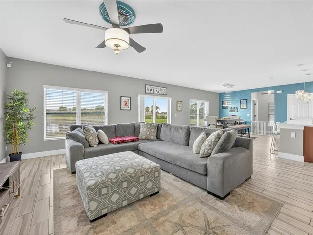 a living room with furniture or couches and a large window