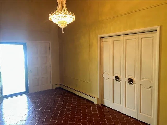 a view of a chandelier in an empty room