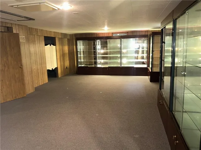 a view of a room with large windows