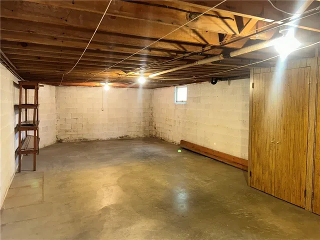 a view of a room with wooden walls