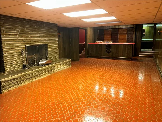 a bathroom with a sink a toilet and a window