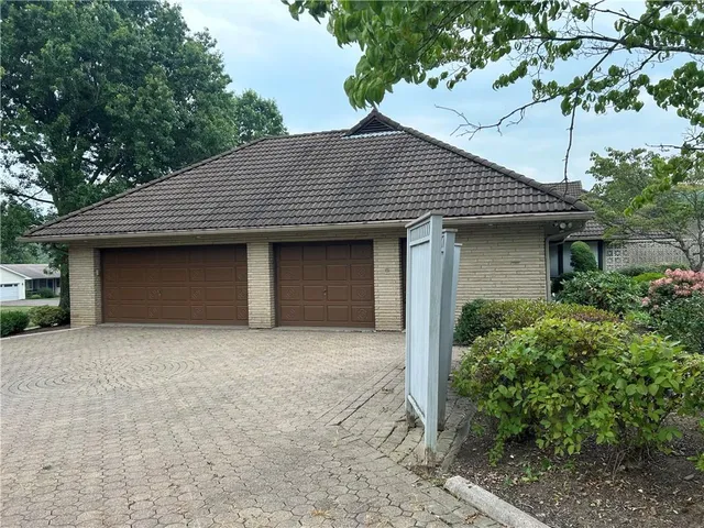 a front view of a house with a yard and porch