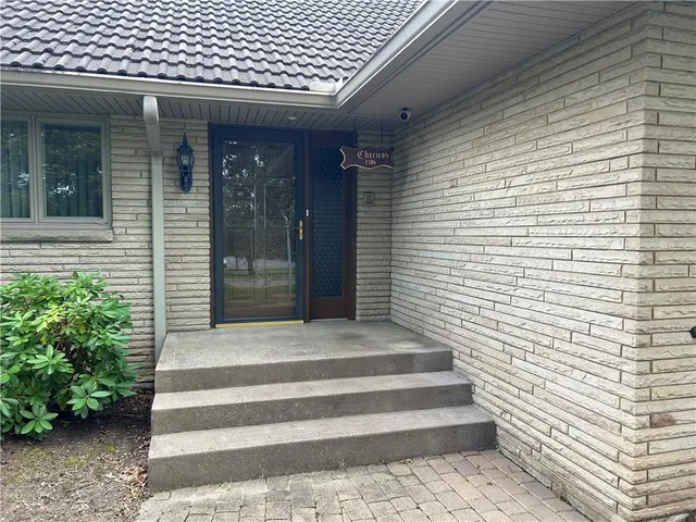 a view of backyard with a chair