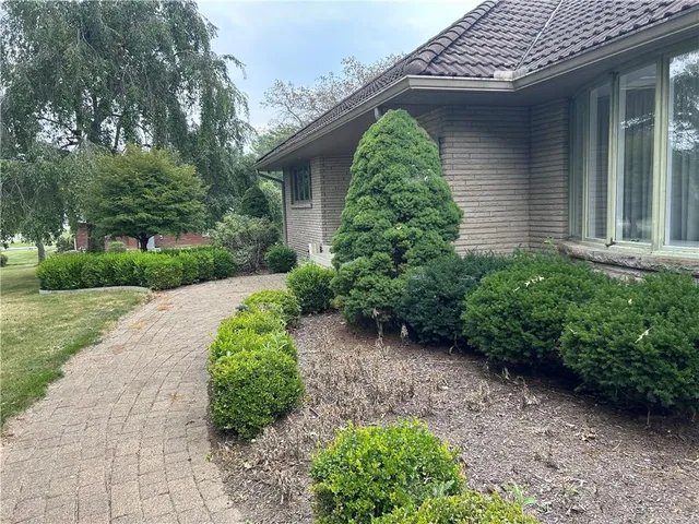 a backyard of a house with lots of green space