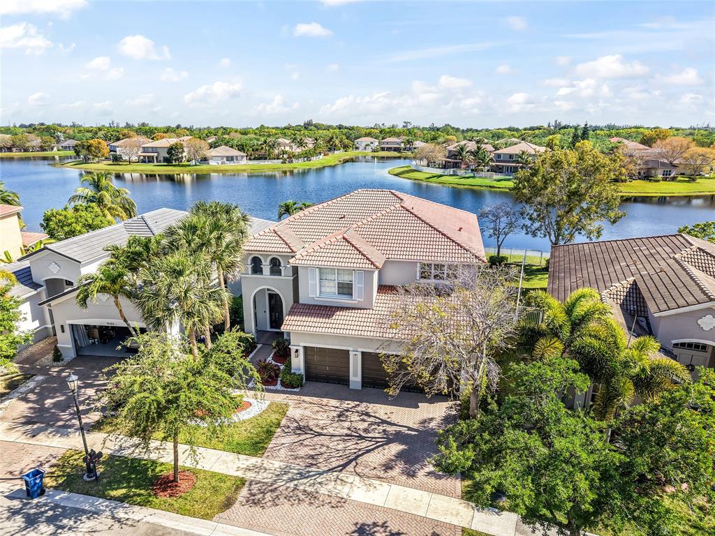 19470 Stonebrook Street Weston, FL 33332 - Photo 2 of 44 a aerial view of a house with a lake view