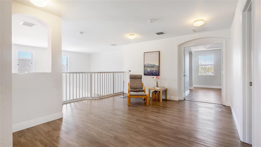 19470 Stonebrook Street Weston, FL 33332 - Photo 22 of 44 a view of a room with wooden floor table and chairs