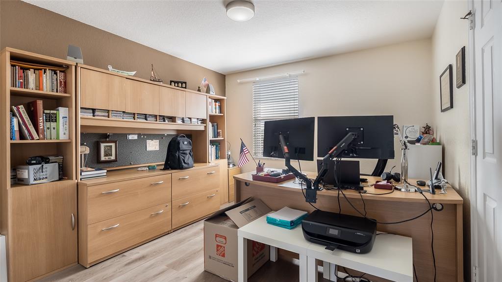 19470 Stonebrook Street Weston, FL 33332 - Photo 28 of 44 a living room with furniture and a flat screen tv