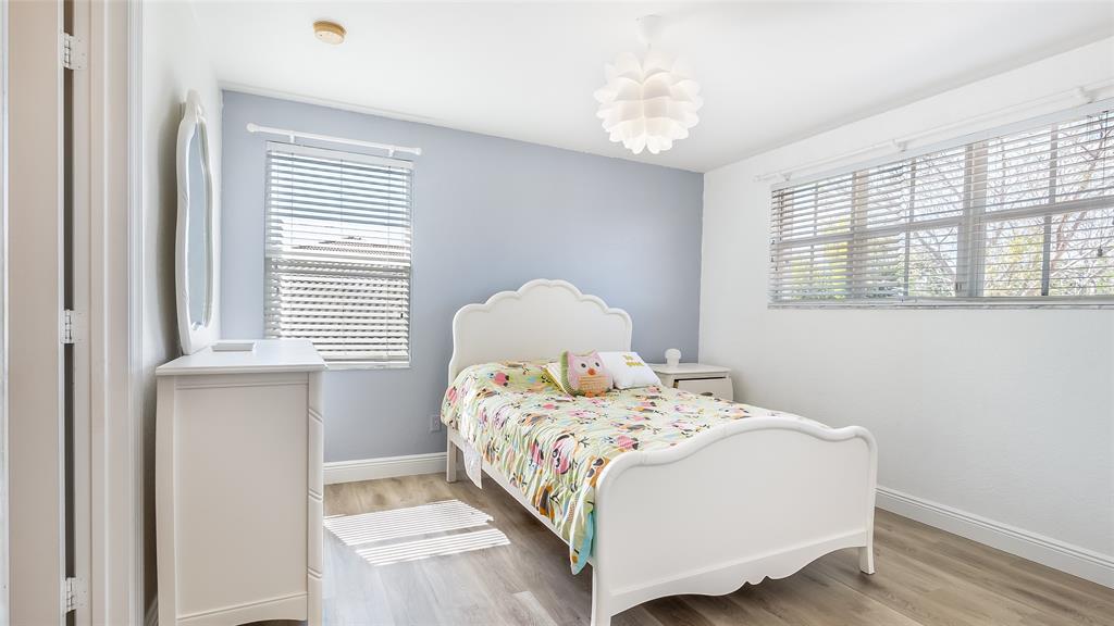 19470 Stonebrook Street Weston, FL 33332 - Photo 30 of 44 a bedroom with a bed and a window