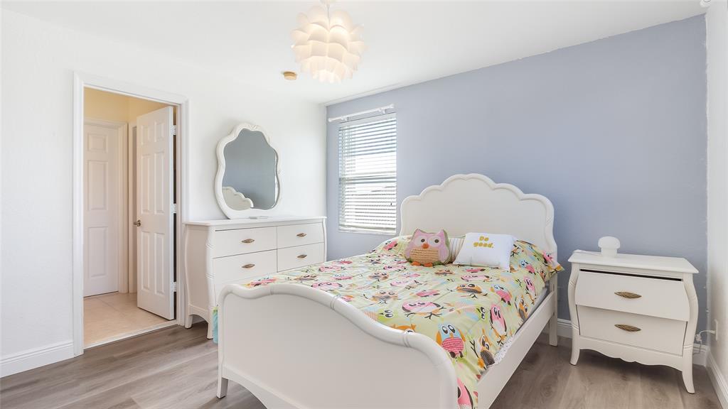 19470 Stonebrook Street Weston, FL 33332 - Photo 31 of 44 a bedroom with a bed and a dresser