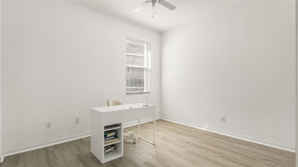 19470 Stonebrook Street Weston, FL 33332 - Photo 37 of 44 an empty room with a workspace